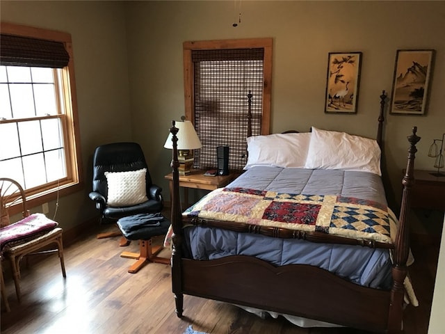 bedroom with hardwood / wood-style floors