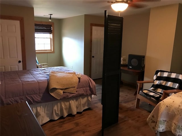 bedroom featuring wood-type flooring and ceiling fan