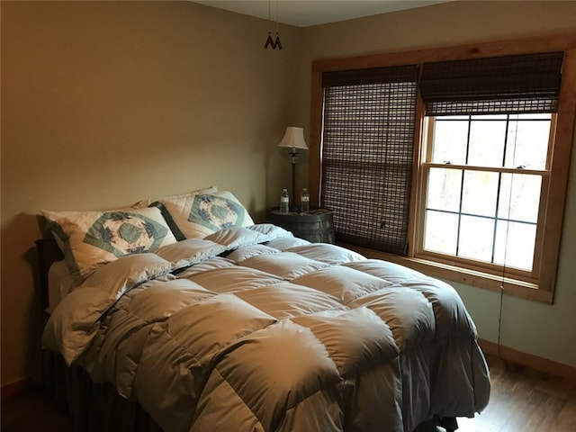 bedroom with hardwood / wood-style floors