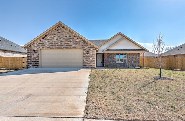 ranch-style house with an attached garage, fence, brick siding, and driveway