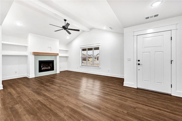 unfurnished living room with visible vents, vaulted ceiling with beams, dark wood-type flooring, ceiling fan, and a fireplace