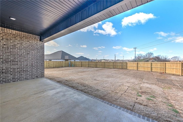 view of yard featuring a fenced backyard and a patio