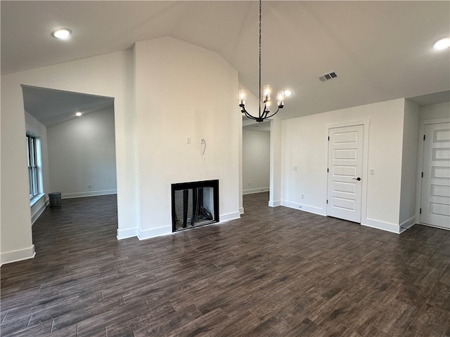 unfurnished living room featuring an inviting chandelier, a multi sided fireplace, dark hardwood / wood-style flooring, and lofted ceiling