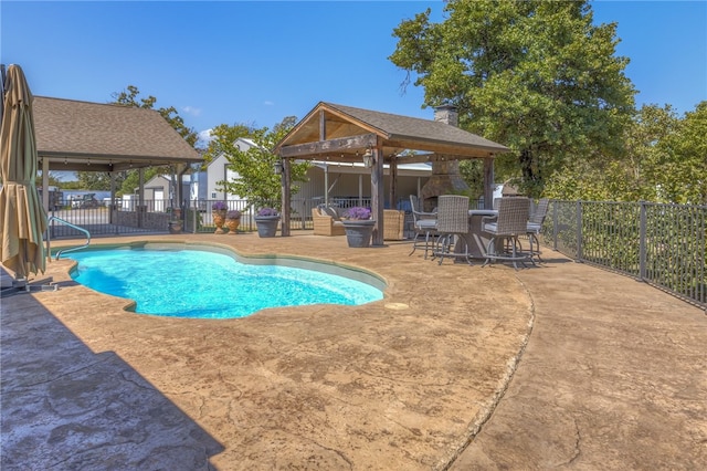 view of pool with a patio and a gazebo