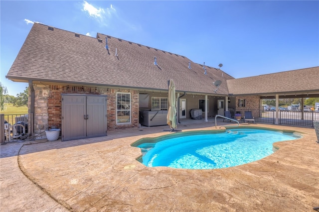 view of swimming pool with a patio area