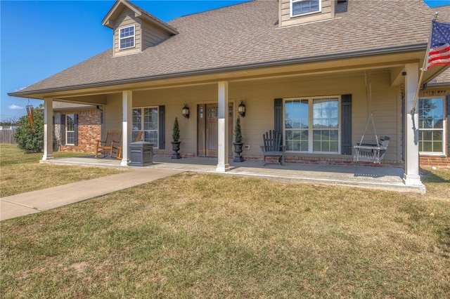 view of front of house with a front lawn and covered porch