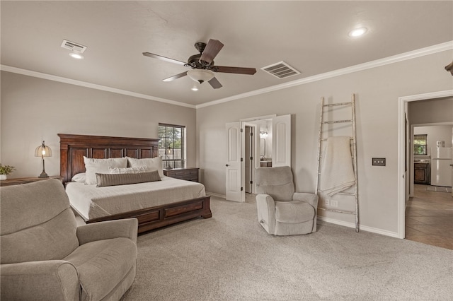 carpeted bedroom featuring ceiling fan and crown molding