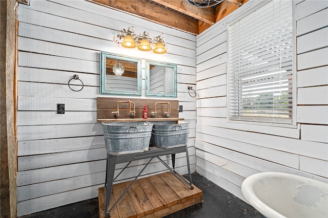 bathroom featuring wood walls