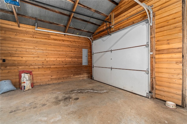 garage with wooden walls and electric panel