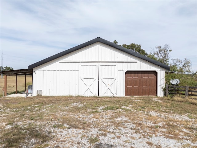 garage featuring wooden walls