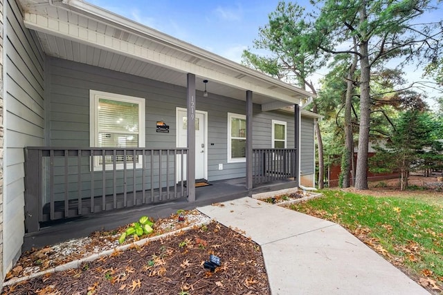view of exterior entry featuring a porch