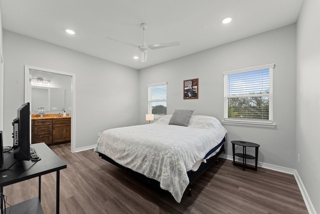 bedroom featuring connected bathroom, ceiling fan, and dark hardwood / wood-style flooring