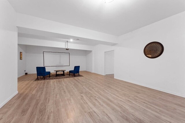 unfurnished room with light wood-style flooring and baseboards