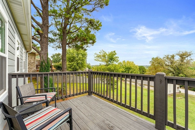 wooden deck with a yard