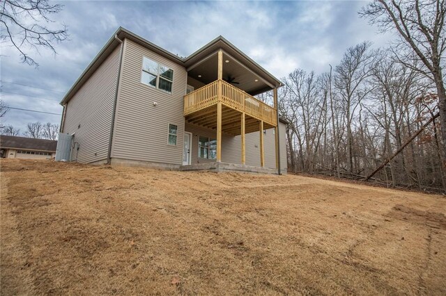 back of property with ceiling fan