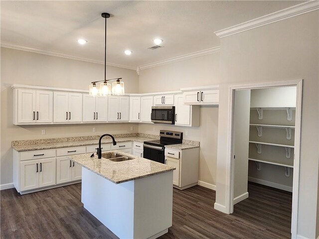 kitchen with visible vents, appliances with stainless steel finishes, ornamental molding, white cabinets, and a sink