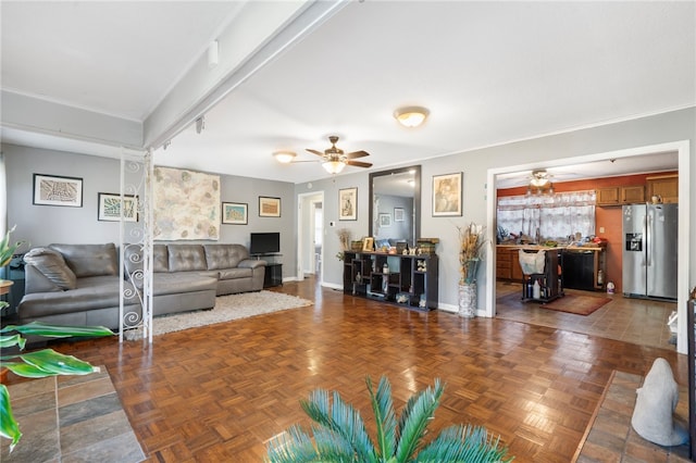 living room with ceiling fan and dark parquet floors