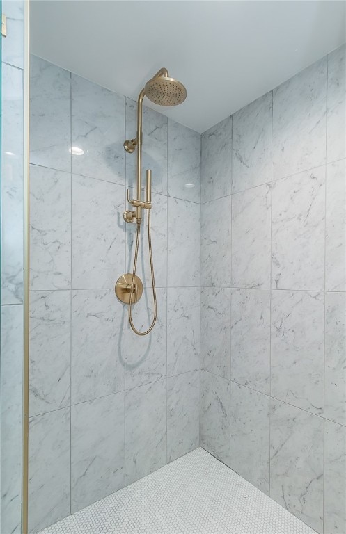 bathroom with tiled shower