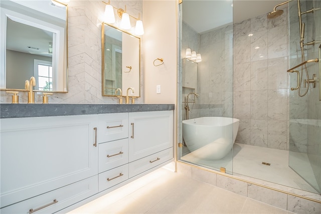 bathroom featuring vanity, tile walls, tile patterned flooring, and separate shower and tub