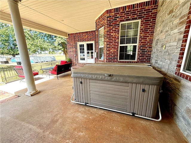 view of patio / terrace featuring a hot tub