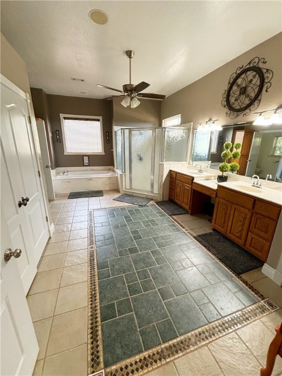 bathroom featuring vanity, ceiling fan, plus walk in shower, and tile patterned floors