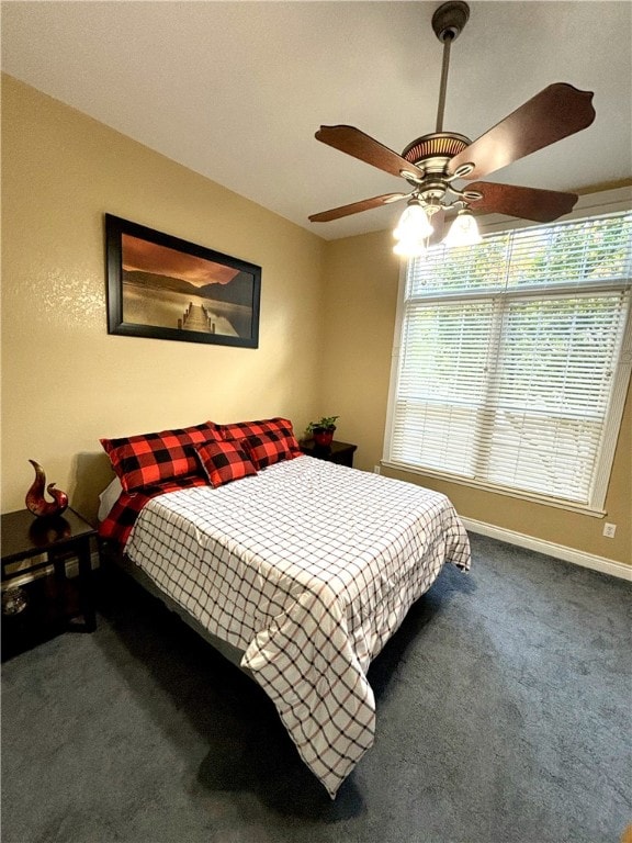 carpeted bedroom featuring ceiling fan