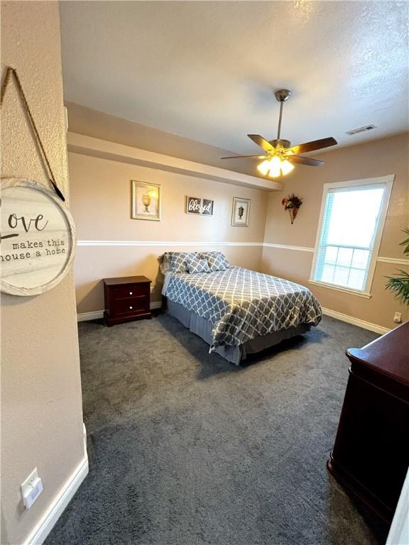 8825 Sky Watch Ln, Decatur, AR 72722 - carpeted bedroom featuring baseboards and ceiling fan
