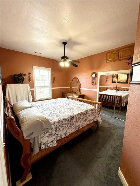 8825 Sky Watch Ln, Decatur, AR 72722 - bedroom featuring dark colored carpet and a ceiling fan