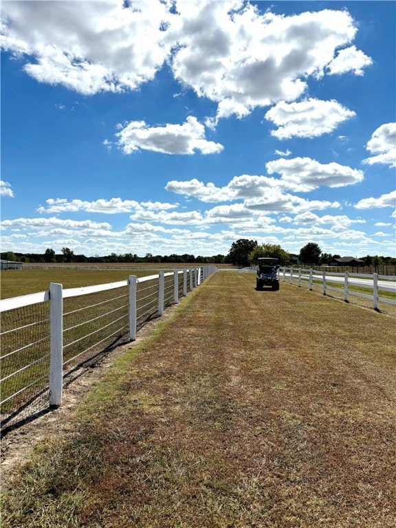 view of yard with a rural view