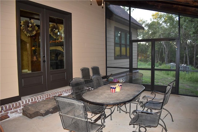 sunroom featuring french doors