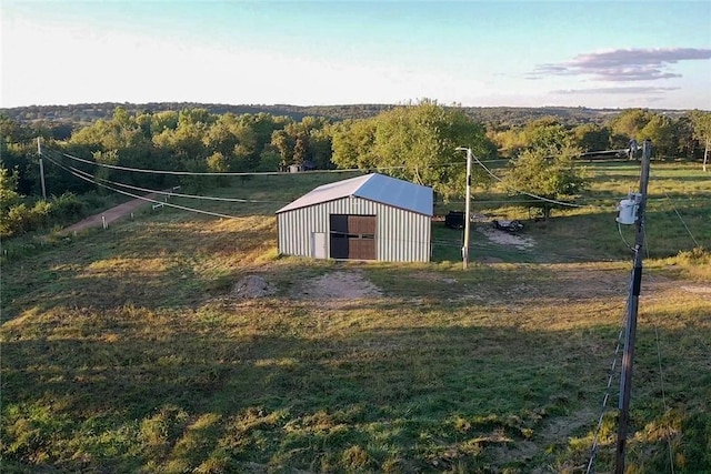 view of outdoor structure featuring a yard