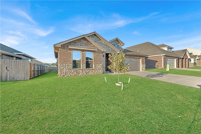 view of front of home featuring a front lawn and a garage