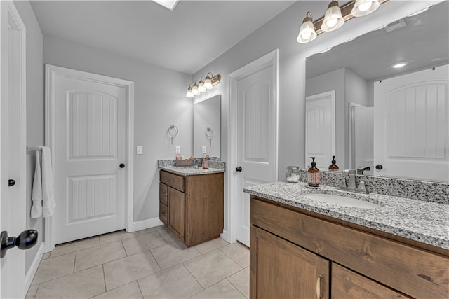 bathroom featuring vanity and tile patterned flooring