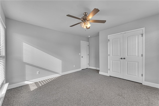 unfurnished bedroom featuring ceiling fan, carpet, and multiple windows