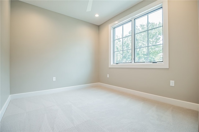 carpeted empty room with ceiling fan