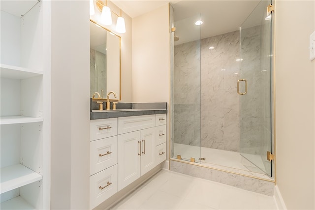 bathroom with tile patterned flooring, a shower with door, and vanity