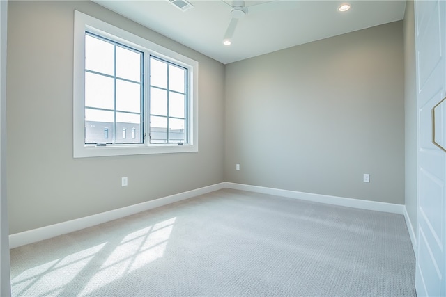 unfurnished room with carpet floors and ceiling fan