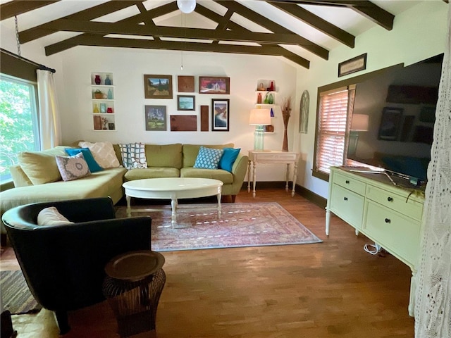 living room featuring ceiling fan, vaulted ceiling with beams, and hardwood / wood-style flooring