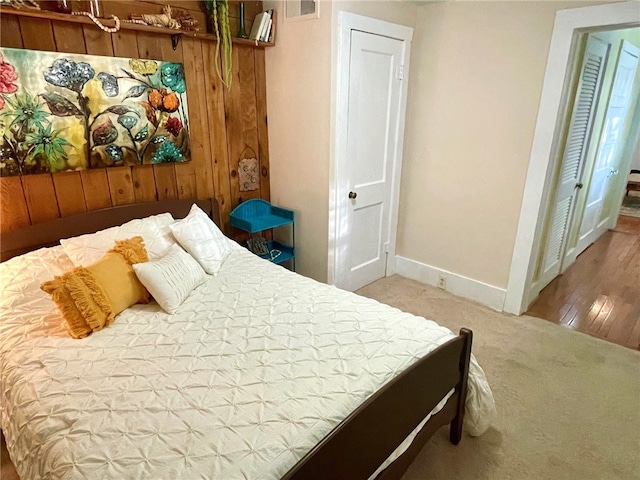 15 Linwood Ave, Eureka Springs, AR 72632 - carpeted bedroom featuring baseboards and wood walls