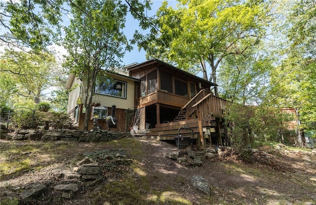 15 Linwood Ave, Eureka Springs, AR 72632 - rear view of house with stairway, a sunroom, and a wooden deck