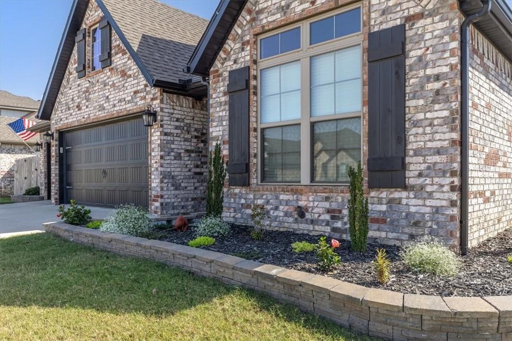 view of side of home with a garage