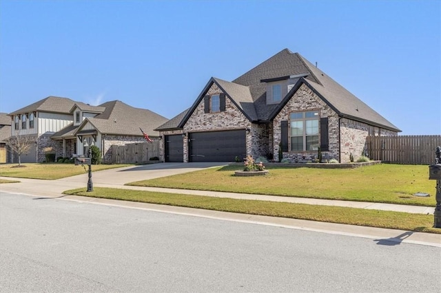 view of front of property with a front lawn and a garage