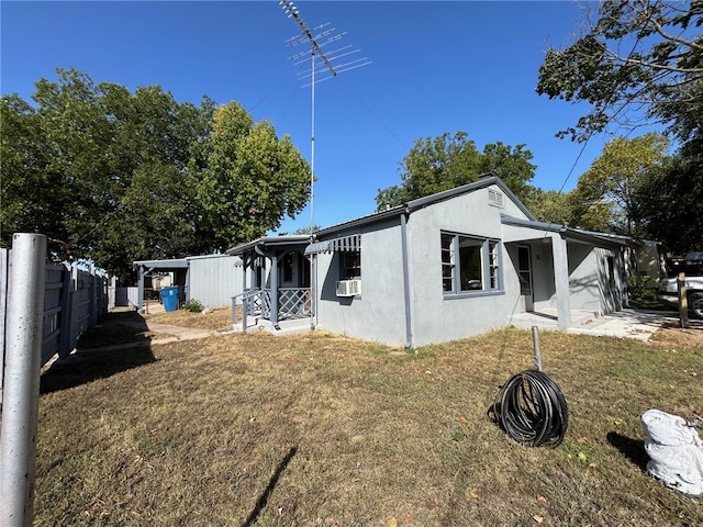 view of property exterior with cooling unit and a yard