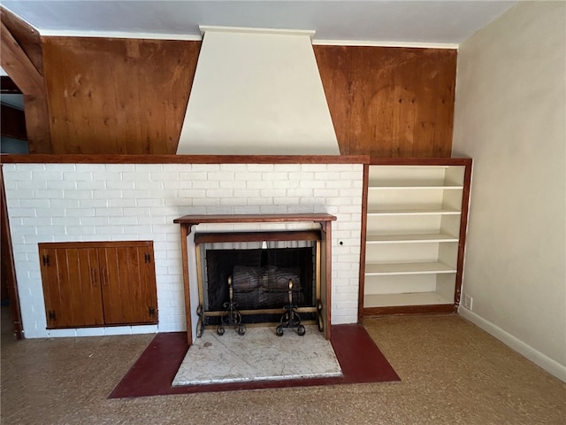 interior details featuring a brick fireplace