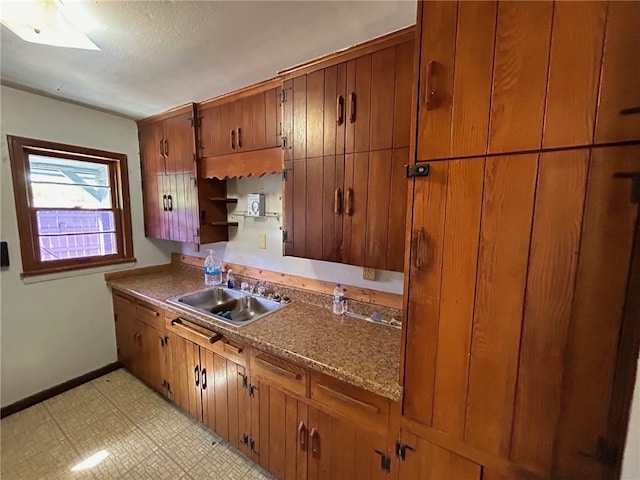 kitchen with light tile patterned flooring and sink