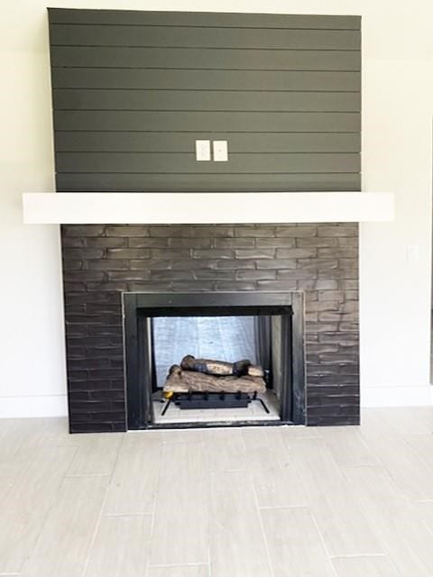 interior details with hardwood / wood-style flooring and a multi sided fireplace