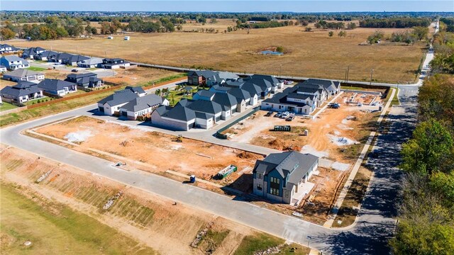 drone / aerial view with a residential view and a rural view