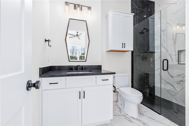 bathroom featuring vanity, a ceiling fan, toilet, marble finish floor, and a marble finish shower