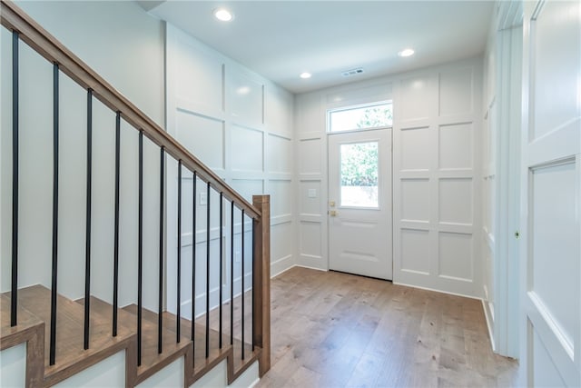 entrance foyer with light hardwood / wood-style flooring