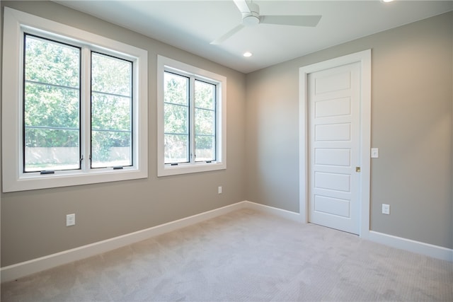 carpeted empty room with ceiling fan